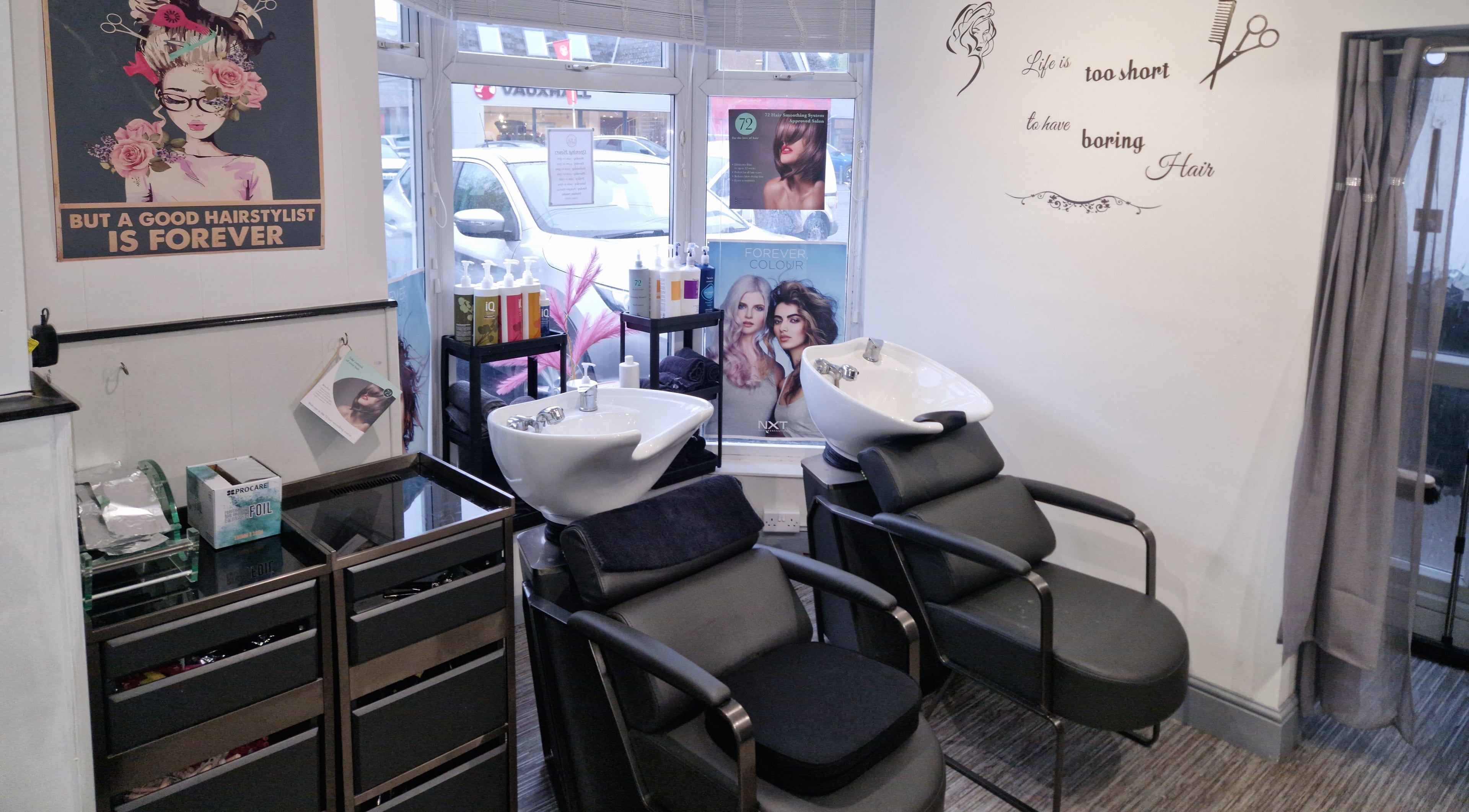 Stylish hair salon chairs and wash basins at Lucie And Lynn, High Wycombe, England, GB.