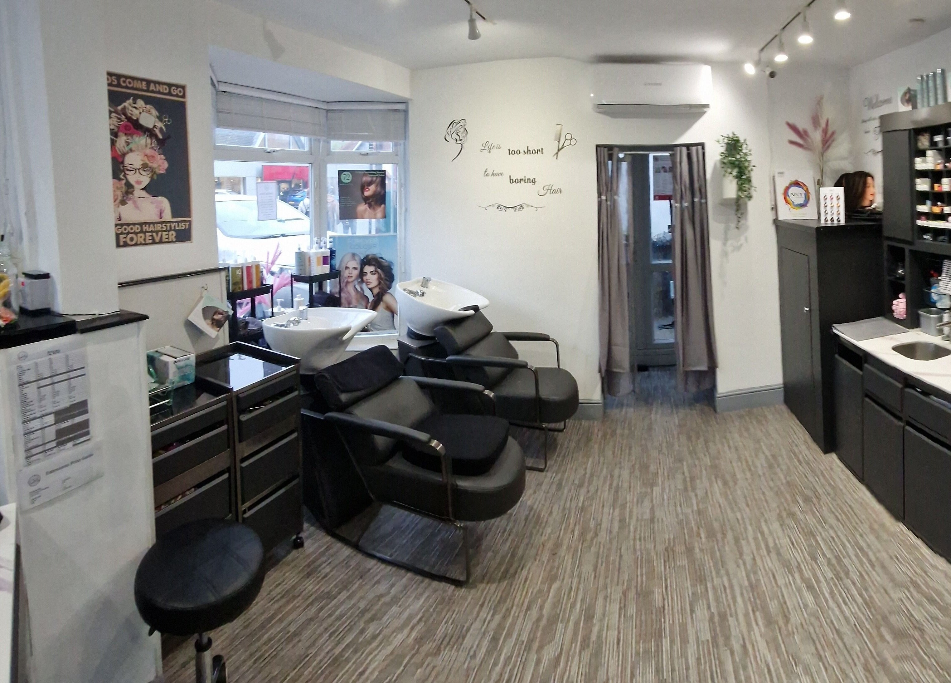 Modern salon at Lucie And Lynn in High Wycombe, England, GB featuring sleek chairs and stylish decor.
