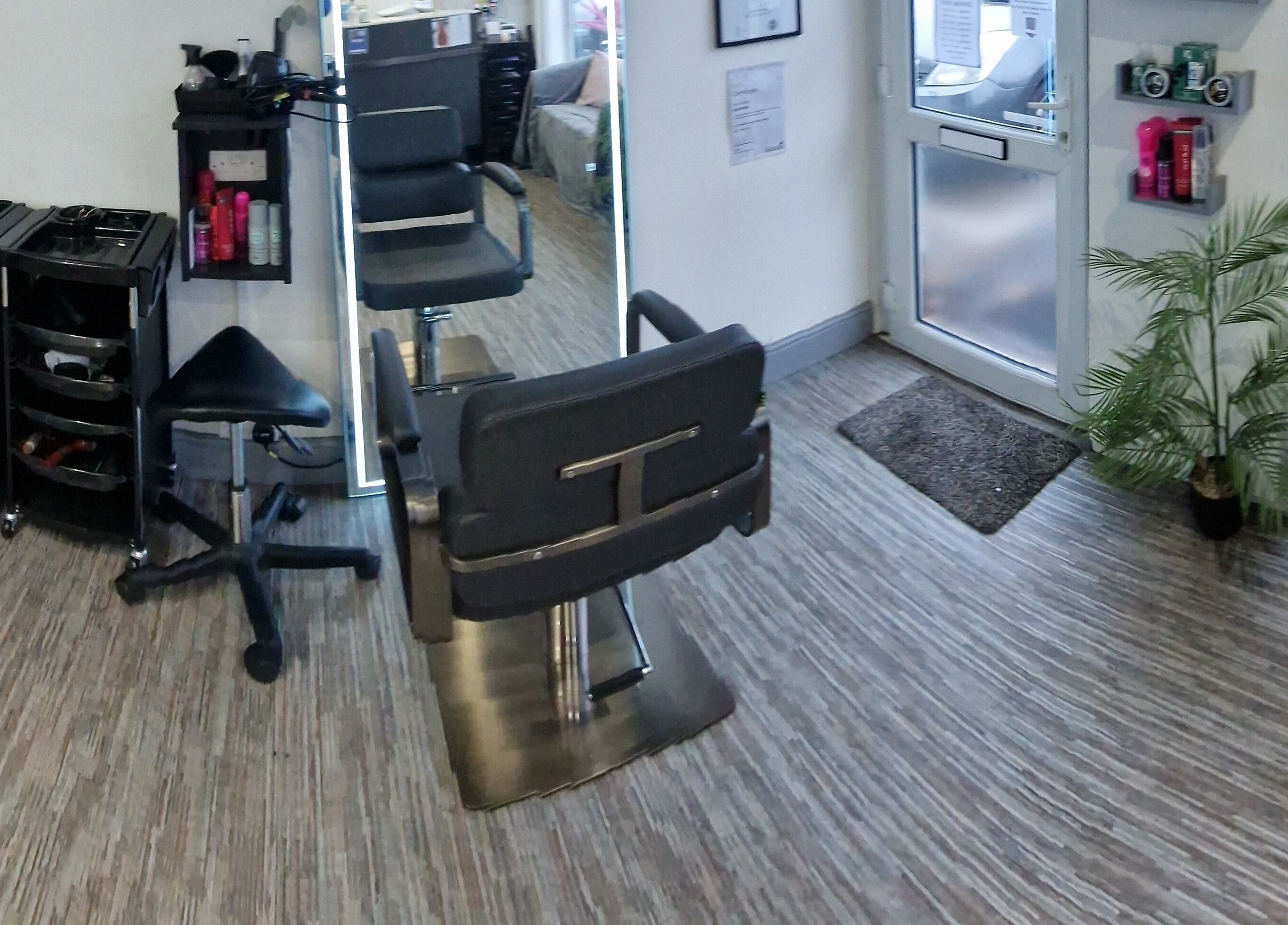 Modern salon interior at Lucie And Lynn, High Wycombe, England, GB with stylish decor and seating.