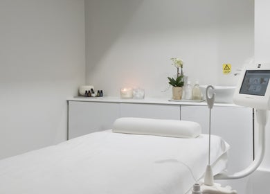 Modern spa treatment room at N and N Knightsbridge, London, England, GB, featuring a massage bed and calming decor.