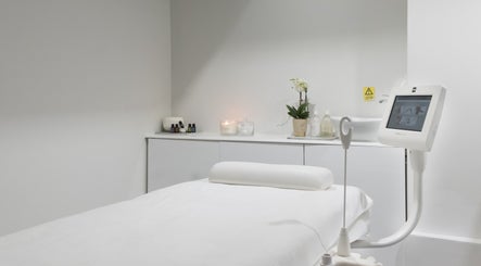 Modern spa treatment room at N and N Knightsbridge, London, England, GB, featuring a massage bed and calming decor.