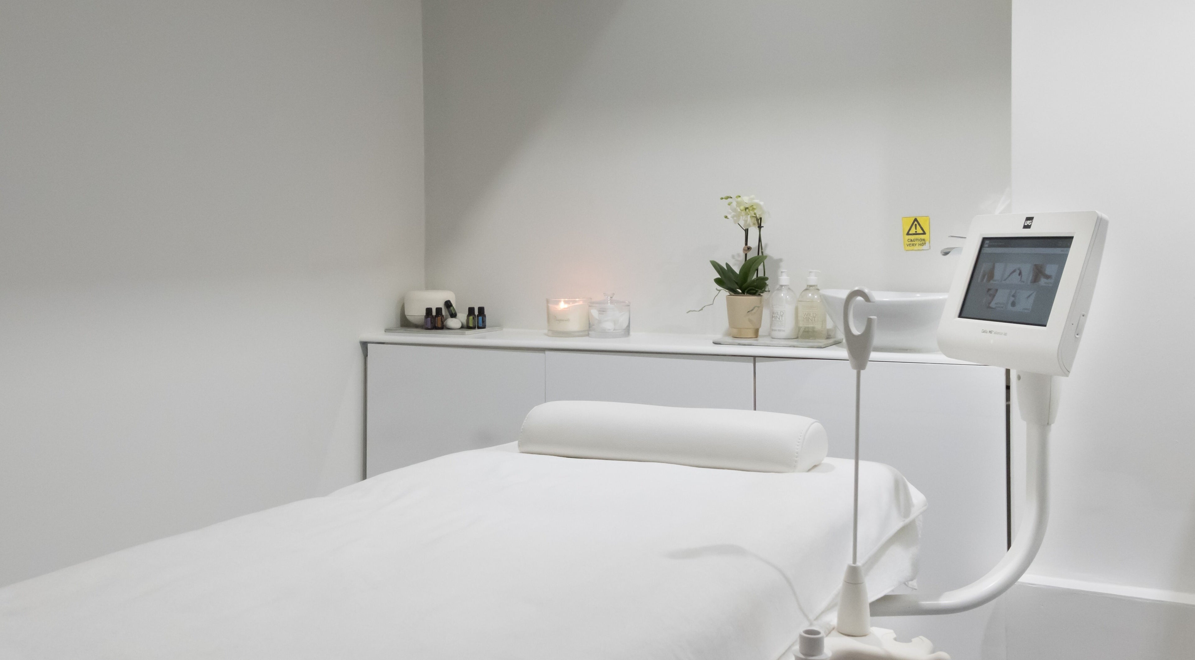Modern spa treatment room at N and N Knightsbridge, London, England, GB, featuring a massage bed and calming decor.