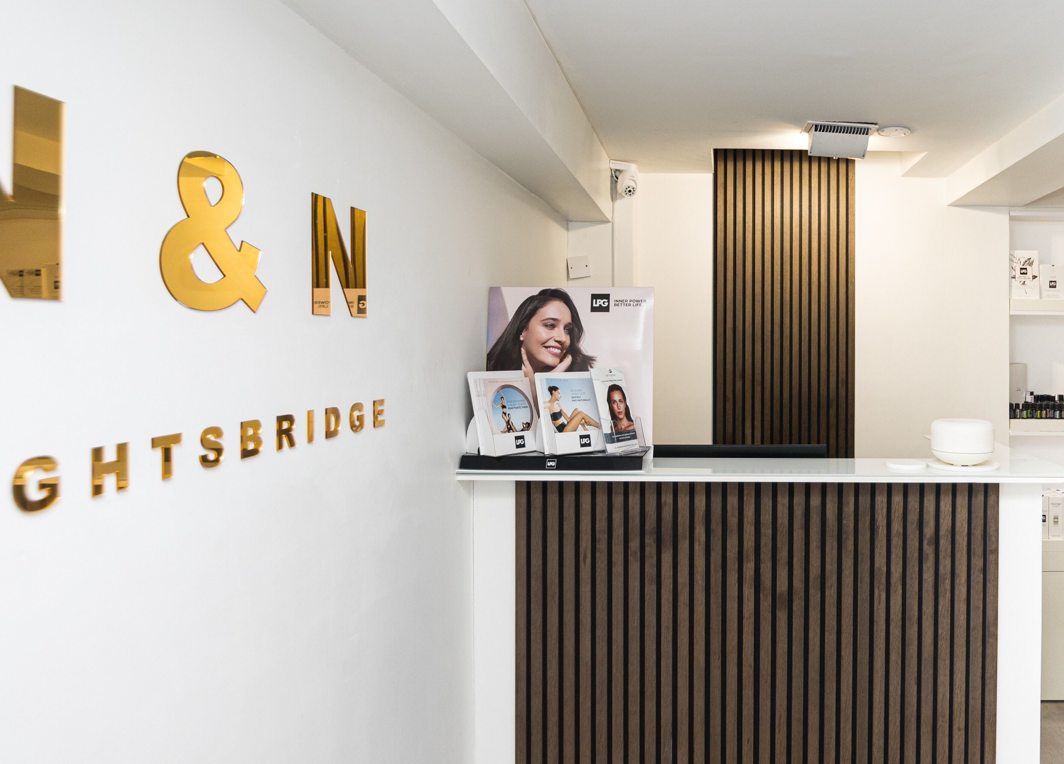 Reception desk at N and N Knightsbridge, London, England, GB, featuring a sleek modern design.