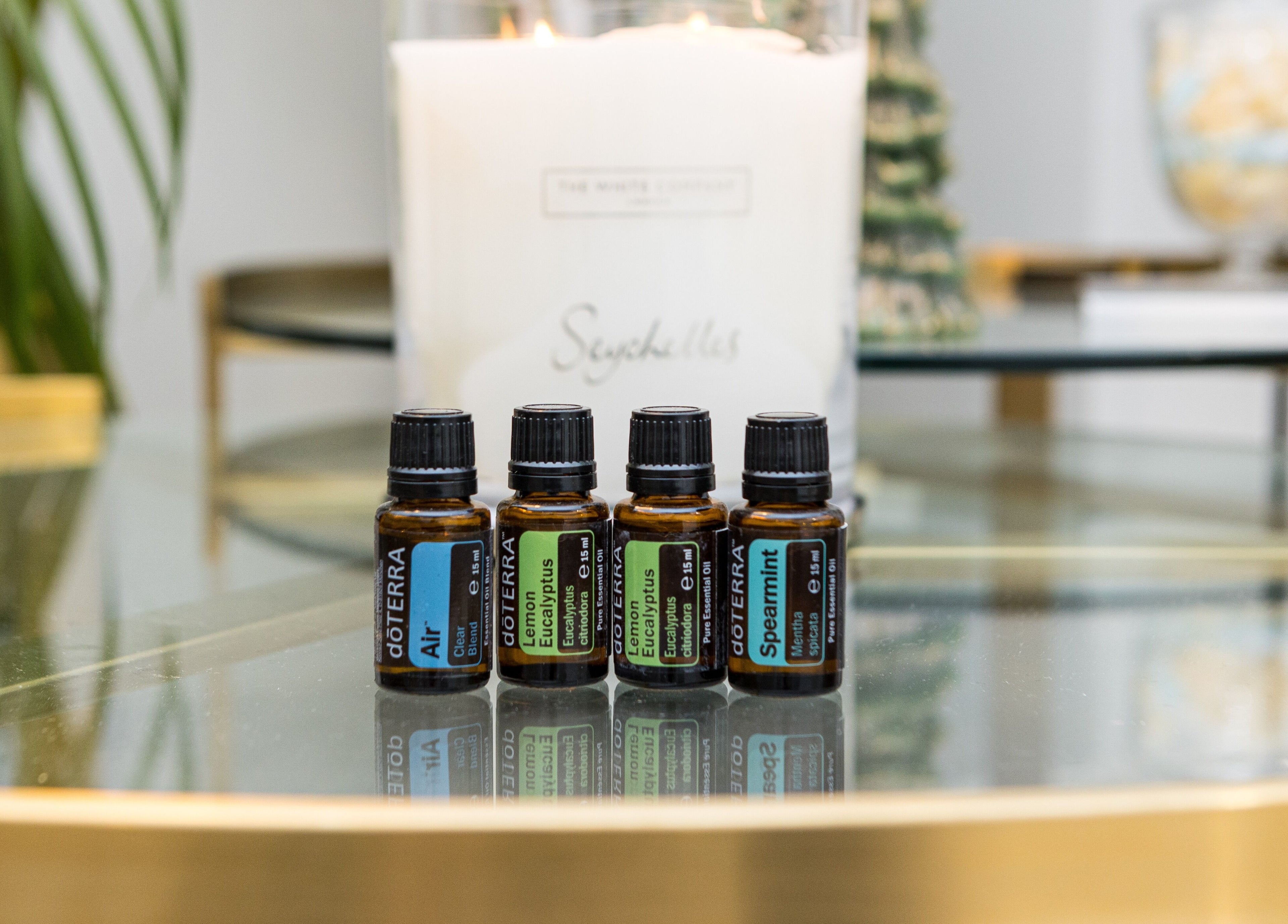 Essential oils on a glass table at N and N Knightsbridge, London, England, GB create a relaxing ambiance.