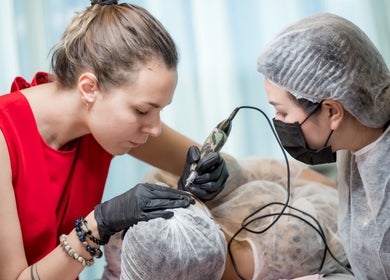 Technician performing scalp micropigmentation at Antidote Beauty Space, Sydney, New South Wales, AU.