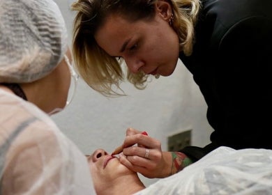 Aesthetician applying lip treatment at Antidote Beauty Space, Sydney, New South Wales, AU.