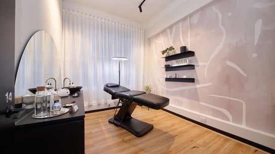 Modern treatment room at Antidote Beauty Space, Sydney, New South Wales, AU with stylish decor and cozy bed.