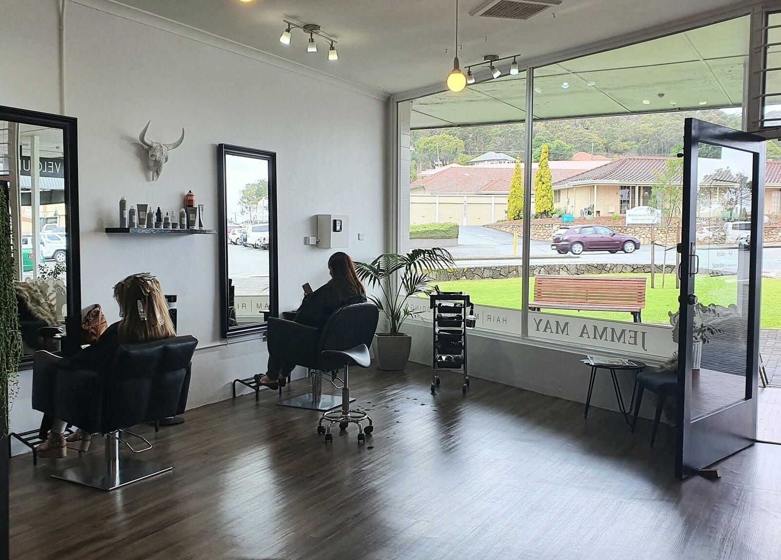 Jemma May salon interior, Albany, Western Australia. Clients relaxing in a serene, modern setting.