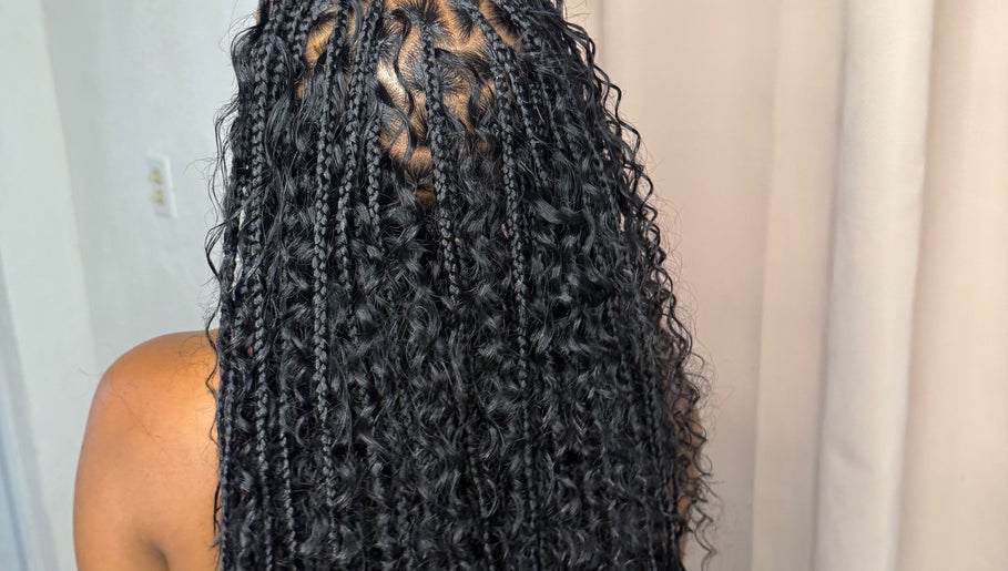 Intricate braided hairstyle at Glam Styles, Princess quarter, SX, showcasing expert styling.