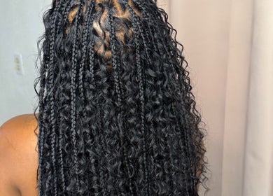 Intricate braided hairstyle at Glam Styles, Princess quarter, SX, showcasing expert styling.