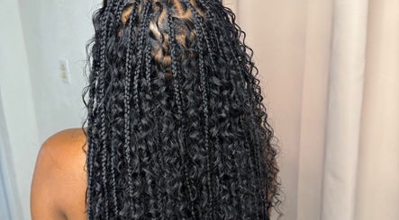 Intricate braided hairstyle at Glam Styles, Princess quarter, SX, showcasing expert styling.