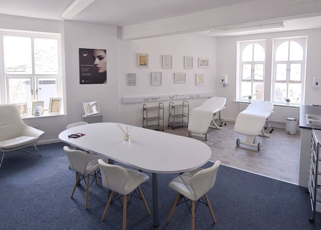 Bright therapy room at The Little Wren, Caernarfon, Wales, GB with massage tables and elegant decor.