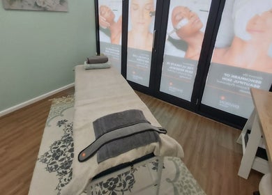 Relaxing therapy room at Azura Health and Beauty in Cape Town, Western Cape, ZA, featuring massage bed and calm decor.