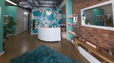 Welcoming reception at Azura Health and Beauty, Cape Town, Western Cape, ZA with floral wall design.