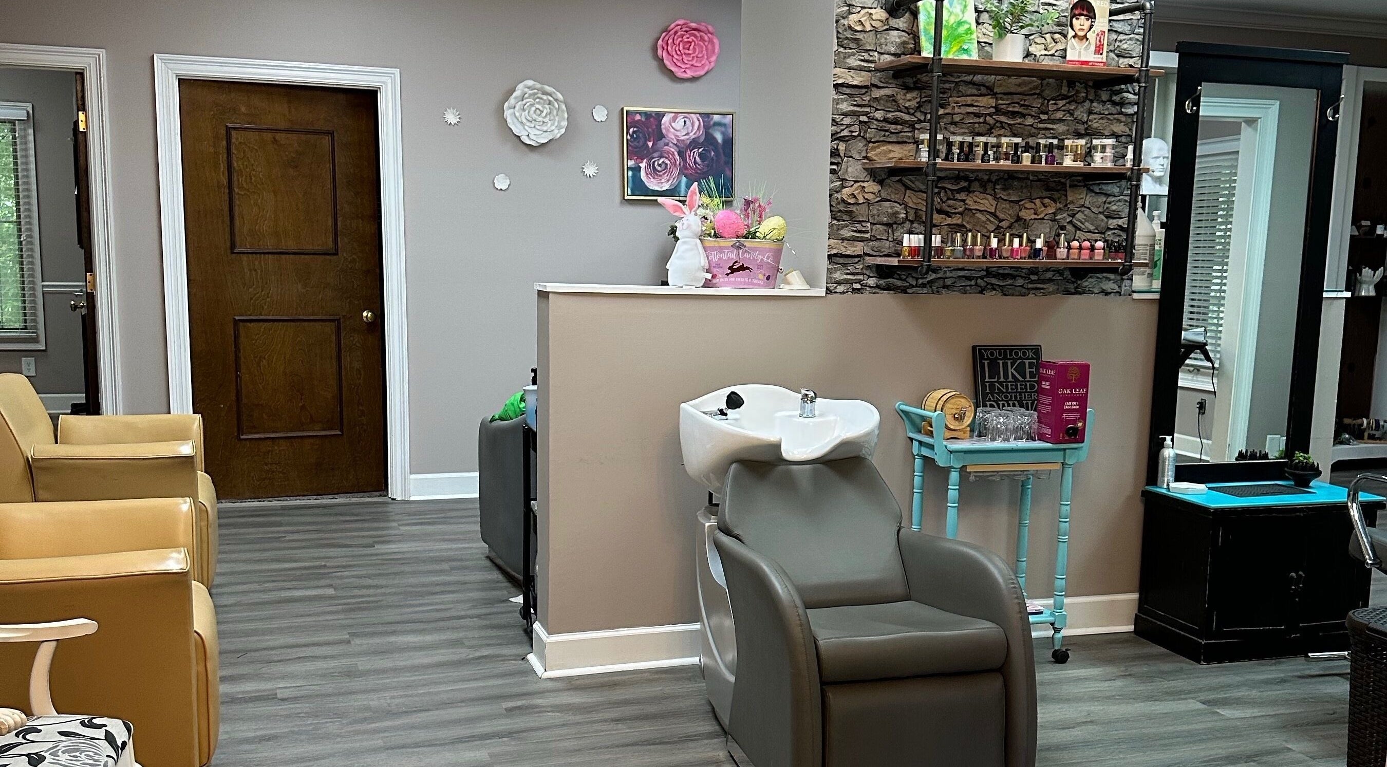 Modern interior of Studio 36 Salon and Spa, Mobile, Alabama, US showcasing wash area and nail products.