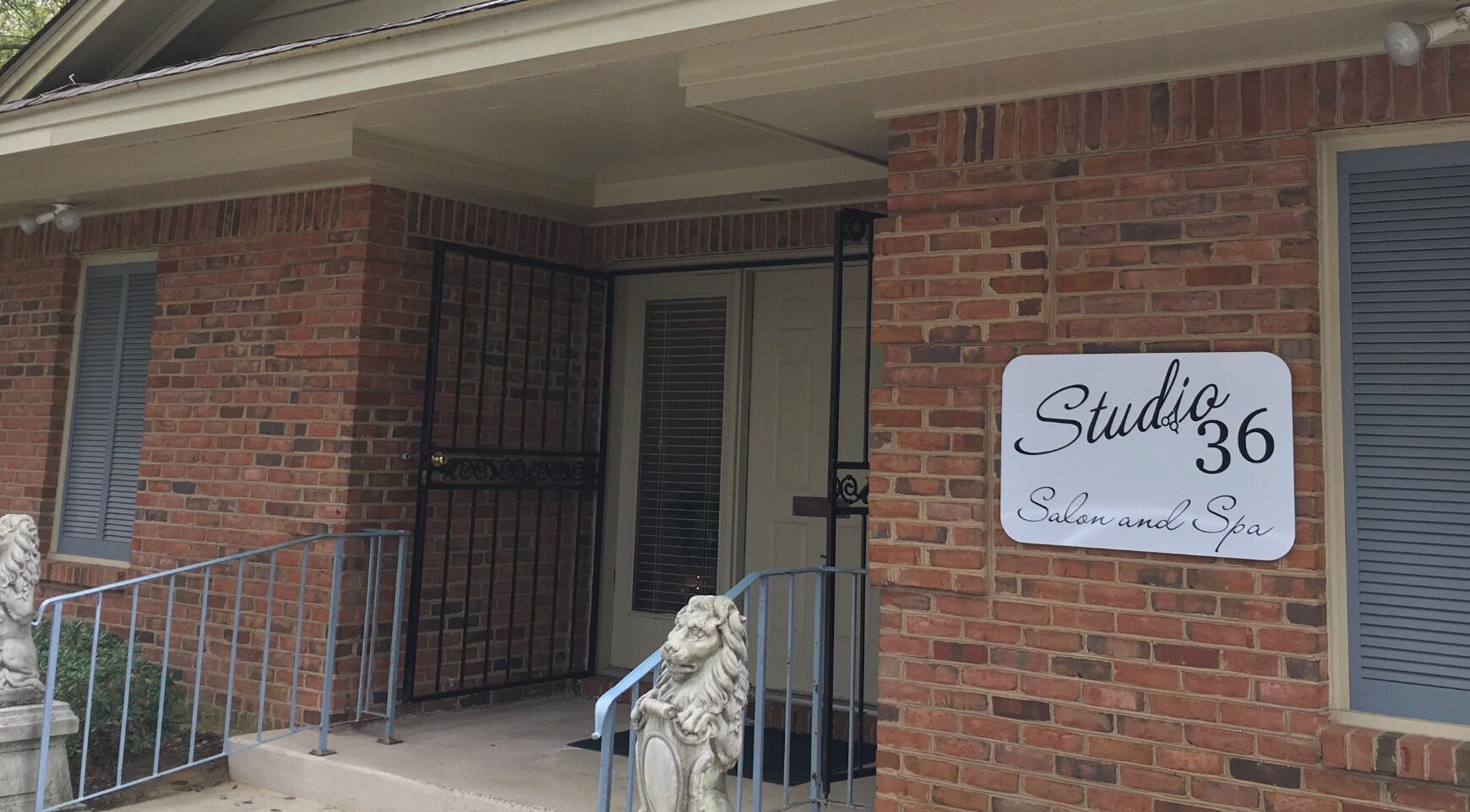Front view of Studio 36 Salon and Spa, located in Mobile, Alabama, US, featuring a welcoming brick exterior.