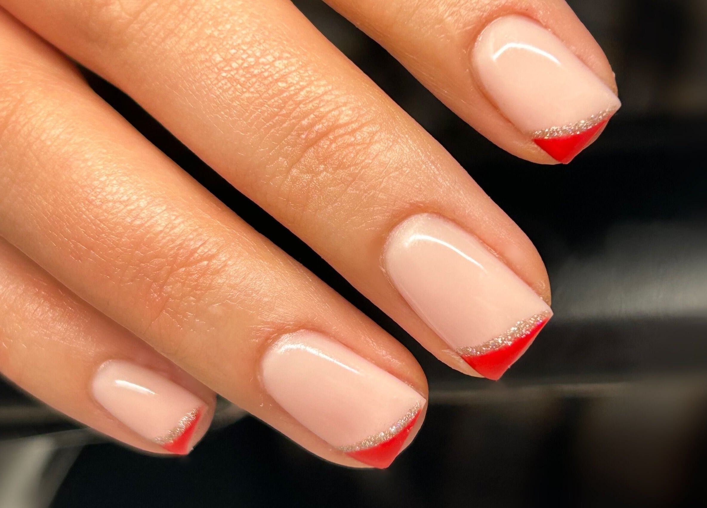 Elegant nail art with red tips at LuxoPolish, Castlethorpe, England, GB.