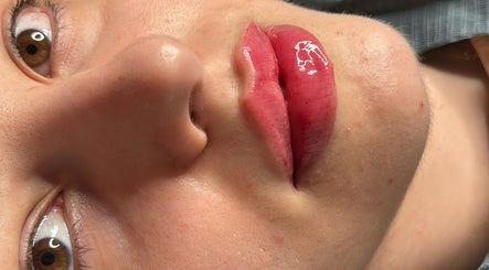 Close-up of glossy lips at The Beauty Spot Liverpool in Liverpool, England, GB. Exemplifies radiant beauty care.