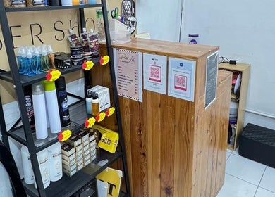Product shelves at Bangcik Barber Shop, BUKIT MERTAJAM, Pulau Pinang, MY showcasing grooming items.