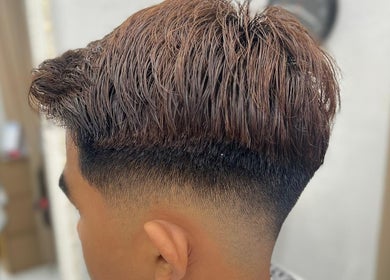 Close-up of a trendy fade haircut at Bangcik Barber Shop, BUKIT MERTAJAM, Pulau Pinang, MY, showcasing expert styling.