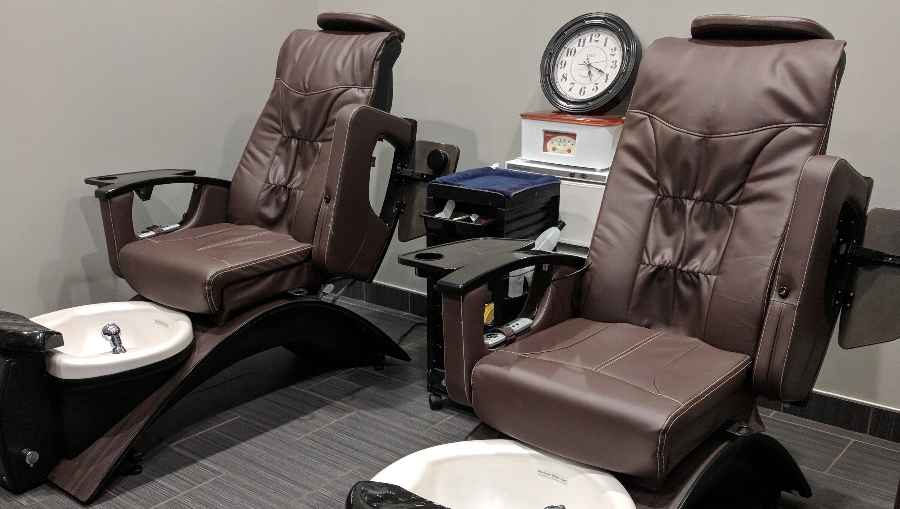 Luxurious pedicure chairs at J. Cole Salon & Spa in Saylor Township, Iowa, US offering relaxing treatments.