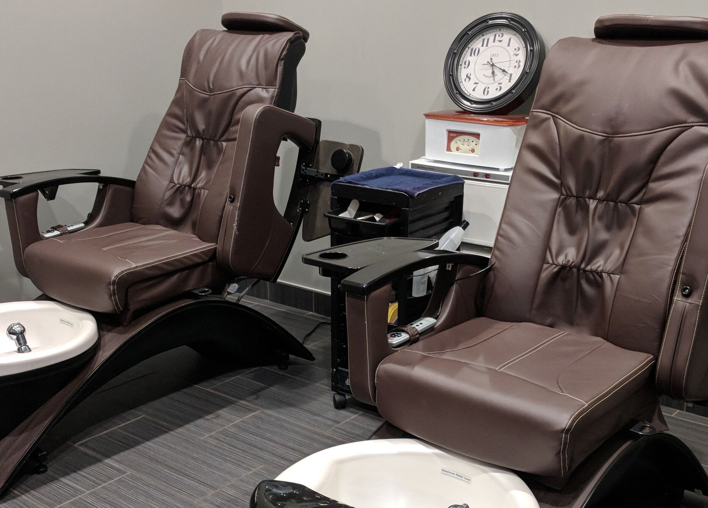 Luxurious pedicure chairs at J. Cole Salon & Spa in Saylor Township, Iowa, US offering relaxing treatments.