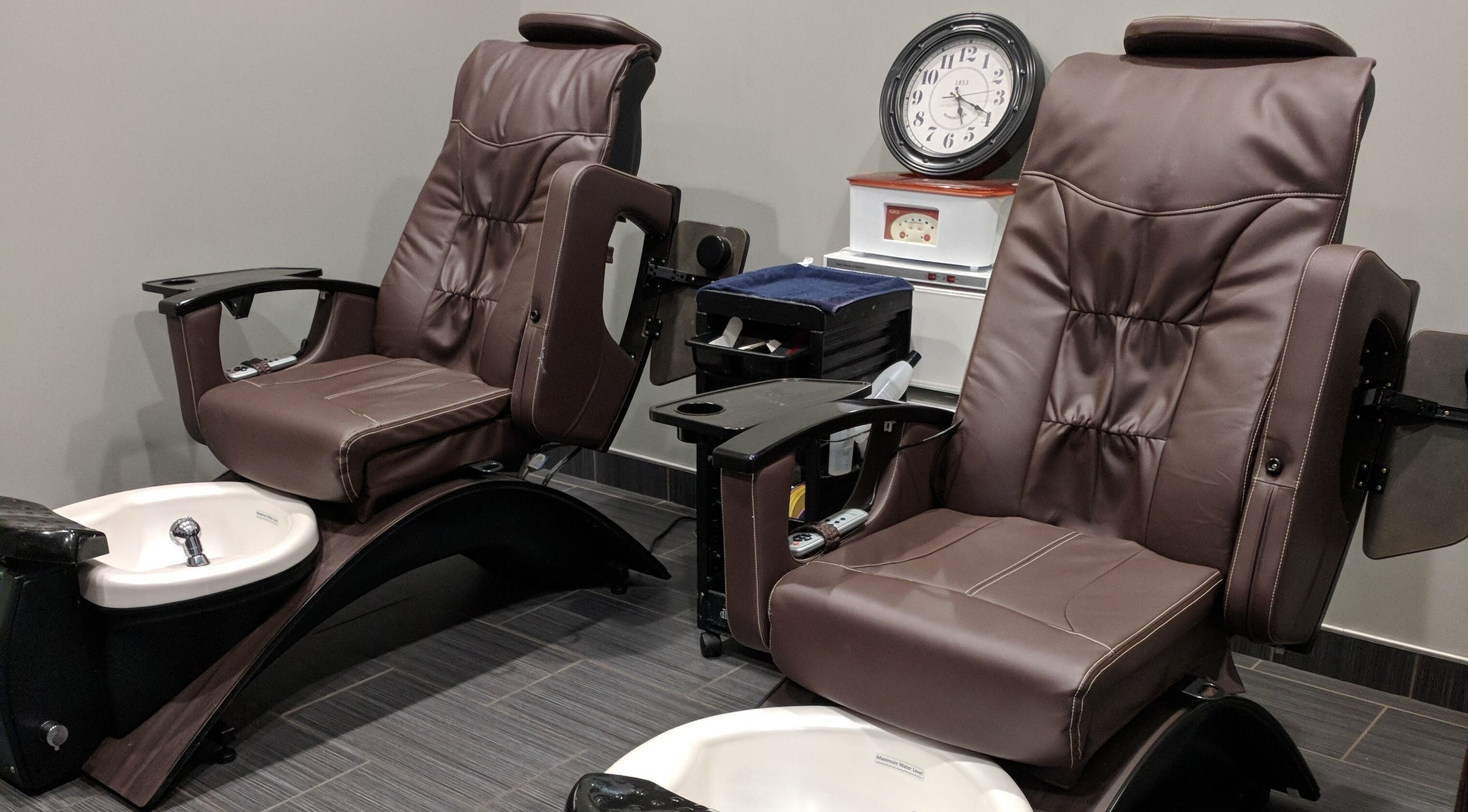 Luxurious pedicure chairs at J. Cole Salon & Spa in Saylor Township, Iowa, US offering relaxing treatments.