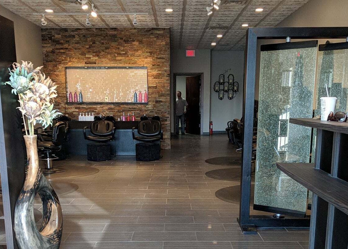 Modern interior of J. Cole Salon & Spa in Saylor Township, Iowa, featuring stylish decor and salon chairs.