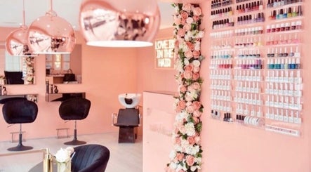 Elegant interior of Collective Beauty London in Coulsdon, England, showcasing chic decor and nail polish display.
