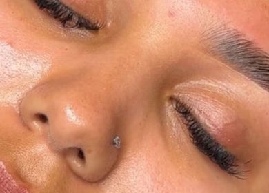 Close-up of a woman's radiant skin showcasing beauty treatment at Collective Beauty London, Coulsdon, England, GB.