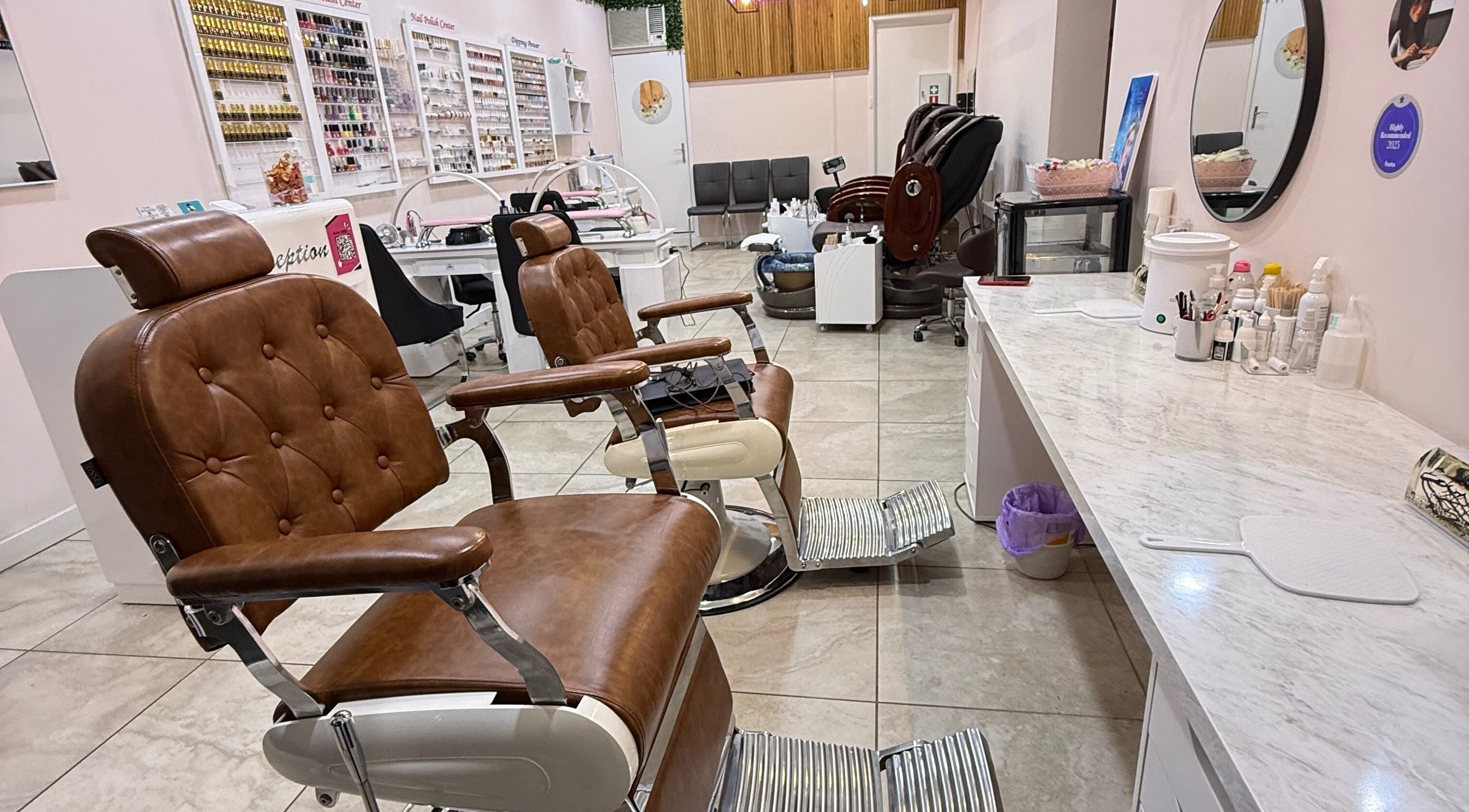 Chic interior of My Brows and Beauty Nail Salon in Melbourne, Victoria, AU showcasing stylish brown leather chairs.