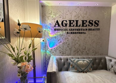Elegant lobby of Ageless Beauty and Wellness Spa in Vancouver, British Columbia, CA with plush seating and floral decor.