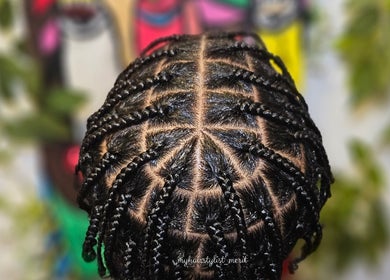 Stylish braided hairstyle at MHM Braids Studio in Dublin, County Dublin, IE, showcasing intricate patterns.
