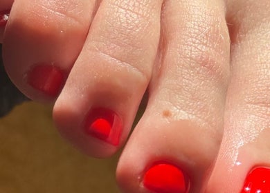 Red pedicure at Mary and Rose, Portsmouth, England, GB, showcasing vibrant nail care services.