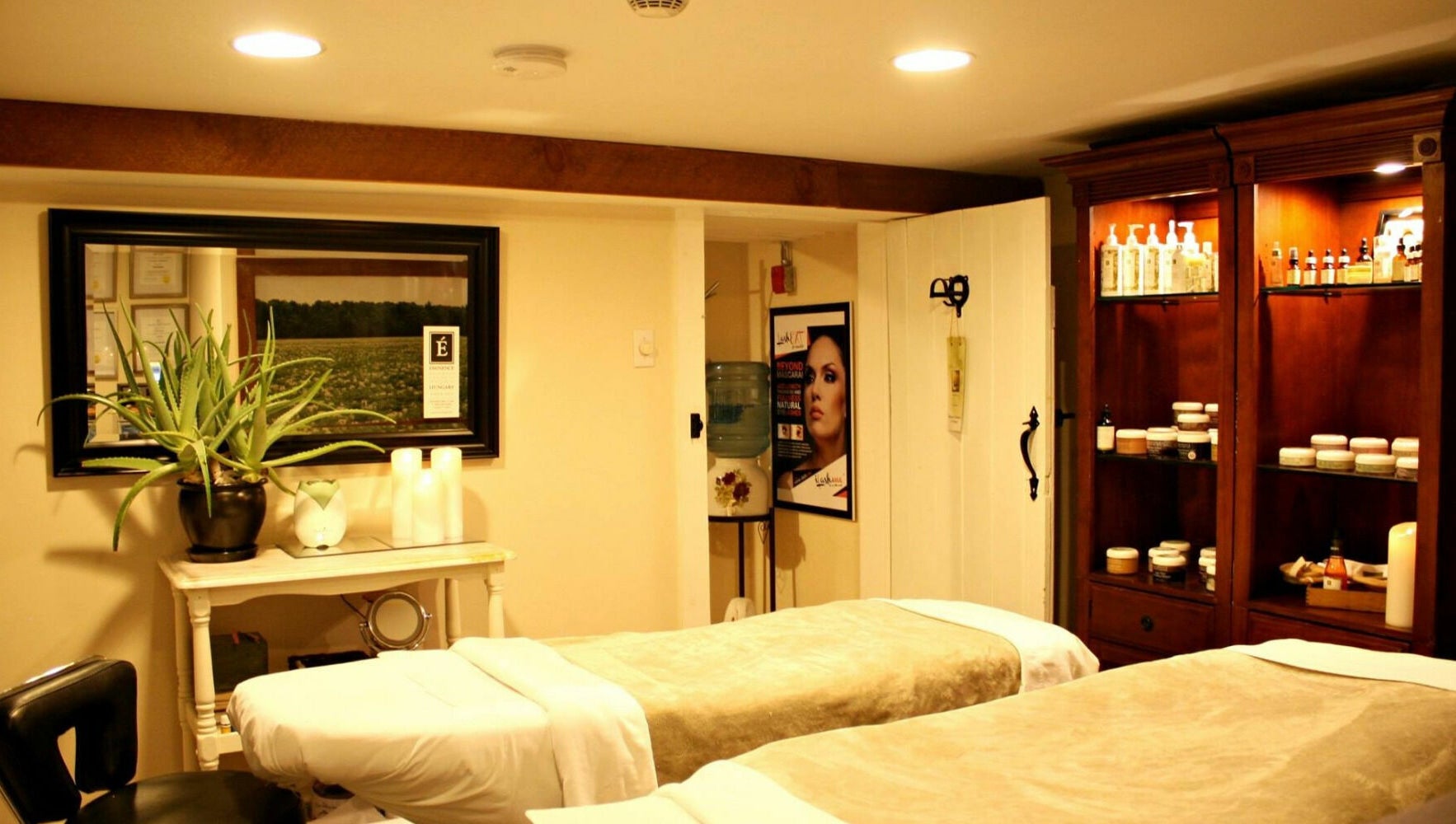 Relaxing massage room at Harvest Spa Stevenson Inn and Spa, Ontario, Ontario, CA, showcasing calm ambiance.