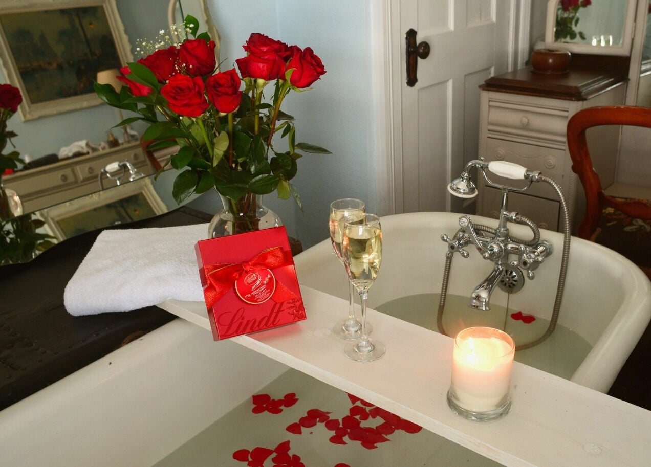 Elegant bath setup with roses and champagne at Harvest Spa Stevenson Inn and Spa, Ontario, Ontario, CA.