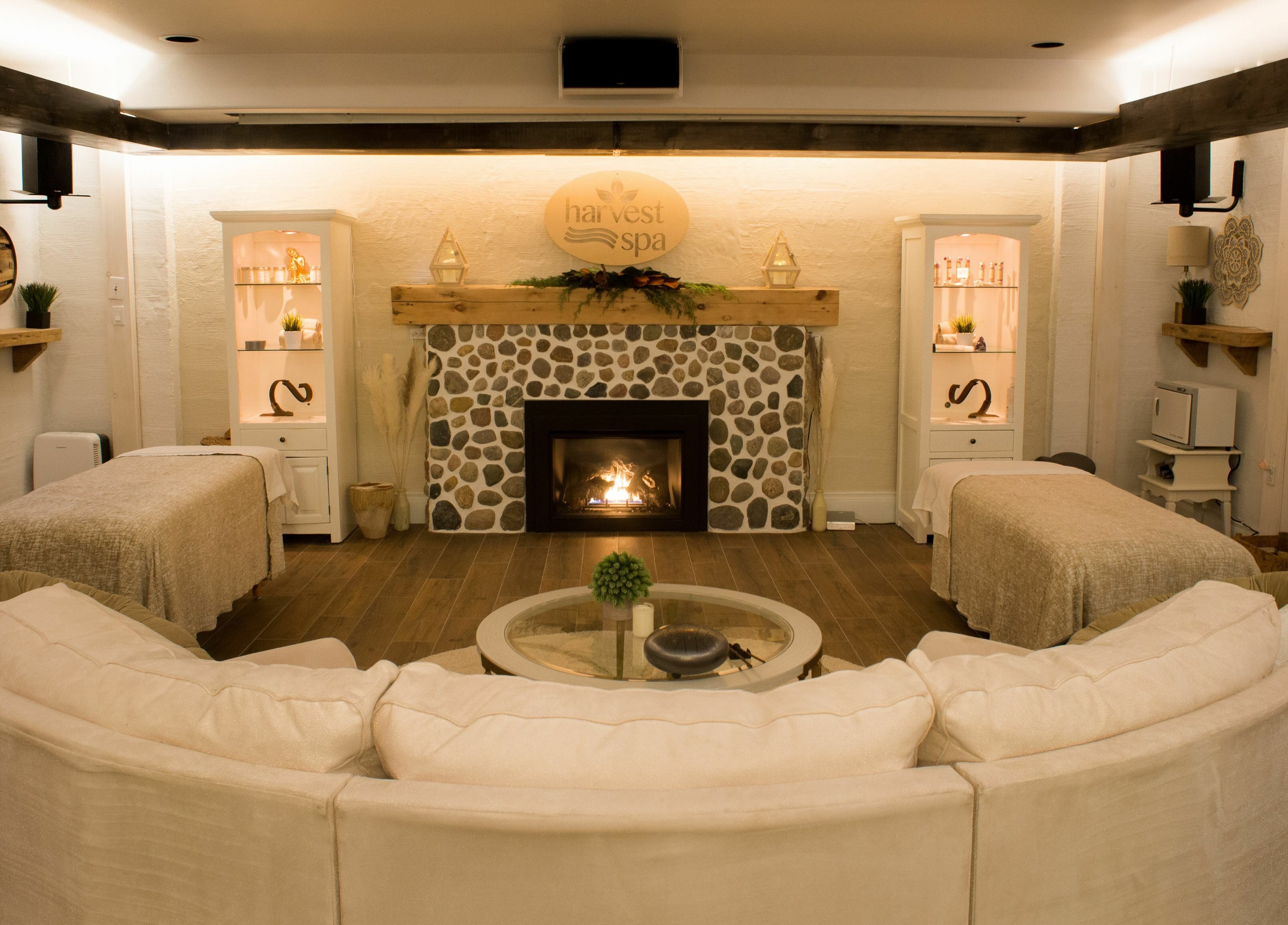 Cozy spa room with fireplace at Harvest Spa Stevenson Inn and Spa, Ontario, Ontario, CA.