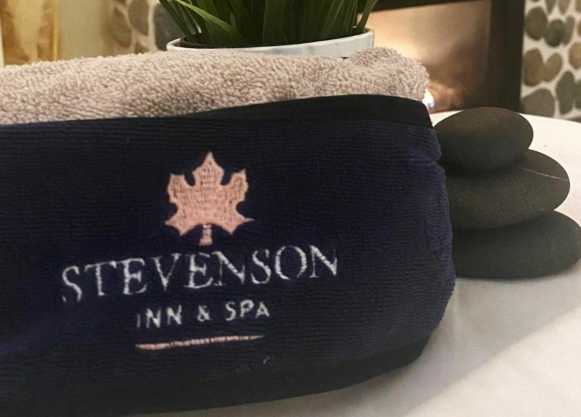 Towel and spa stones at Harvest Spa Stevenson Inn and Spa, Ontario, Ontario, CA.
