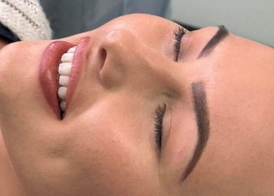 Happy client with flawless brows at Jade Brennan Permanent Makeup, Cambridge, England, GB.