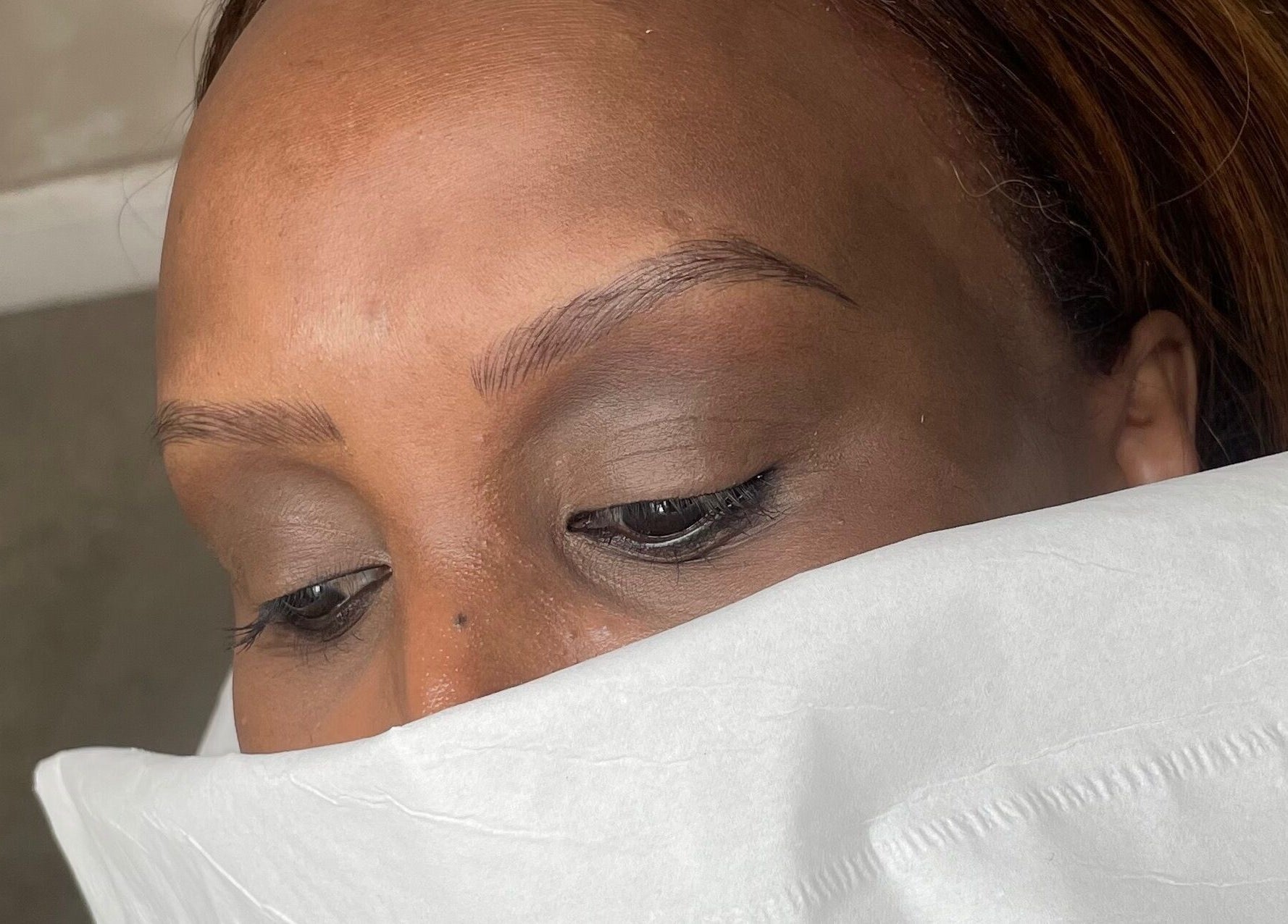 Client receiving beauty treatment at Lux&co Beauty Bar, Cardiff, Wales, GB, showcasing relaxation.