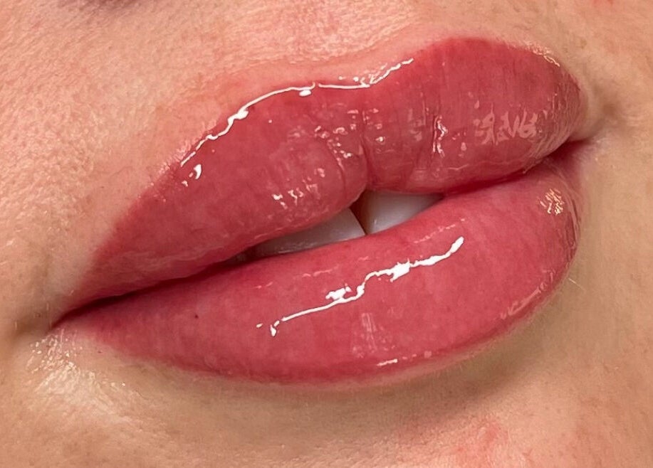 Close-up of glossy lips at Lux&co Beauty Bar, Cardiff, Wales, GB, showcasing premium lip treatments.