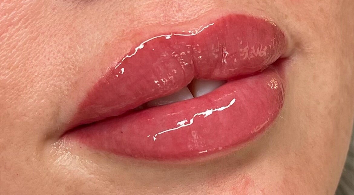 Close-up of glossy lips at Lux&co Beauty Bar, Cardiff, Wales, GB, showcasing premium lip treatments.