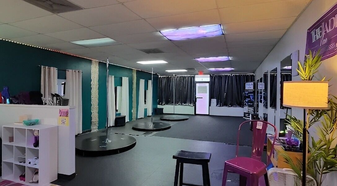 Spacious pole fitness studio at The Jade Vine Pole Fitness in Madison, Alabama, US. Modern and inviting.