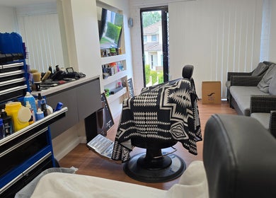 Interior view of 2K Cuts Barbershop, West Hoxton, NSW, featuring a stylish chair and grooming tools.
