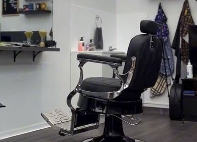 Stylish barber chair at 2K Cuts Barbershop in West Hoxton, New South Wales, AU. Modern interior with sleek design.