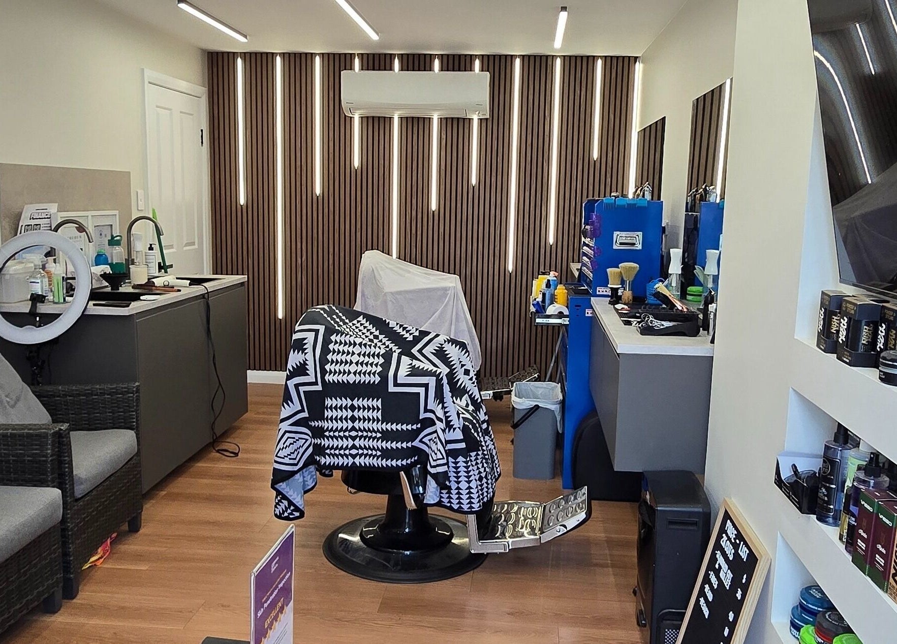 Interior of 2K Cuts Barbershop in West Hoxton, NSW, showcasing stylish barber setup and modern decor.