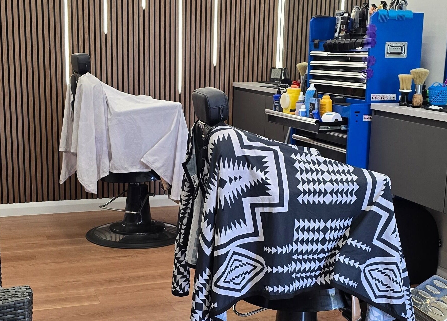 Modern interior of 2K Cuts Barbershop, West Hoxton, New South Wales, AU with stylish barber chairs.