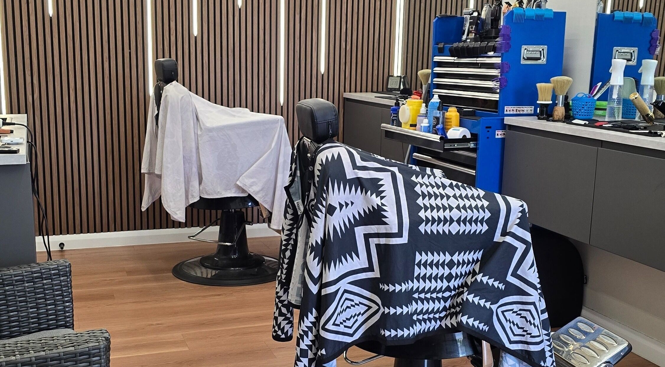 Modern interior of 2K Cuts Barbershop, West Hoxton, New South Wales, AU with stylish barber chairs.