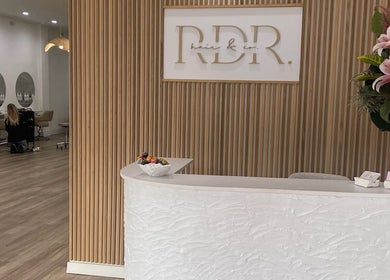 Reception area at Shh Beauty Secrets, Croydon, Victoria, AU, with floral decor and modern seating.