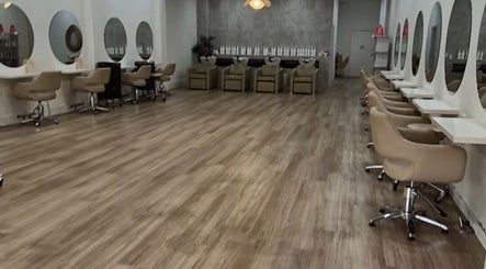 Spacious modern salon interior at Shh Beauty Secrets, Croydon, Victoria, AU, with stylish chairs and mirrors.